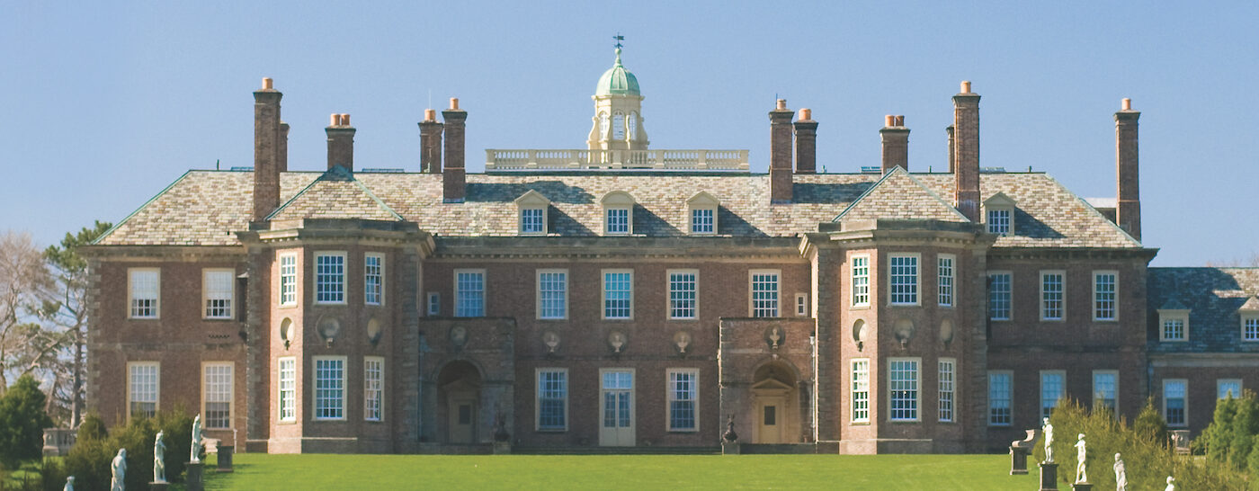 Wide-angle view of the Great House at Castle hill with blue sky in the background