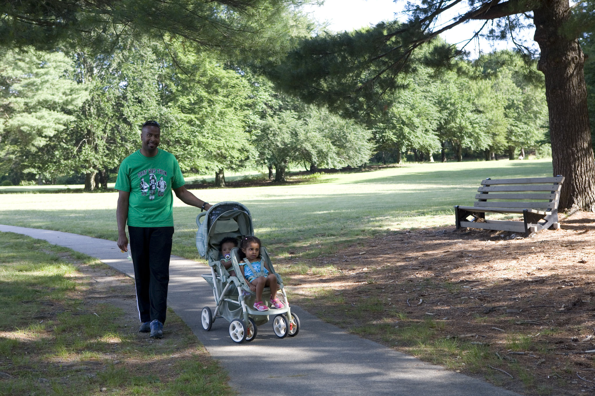 Man walking kids in stroller