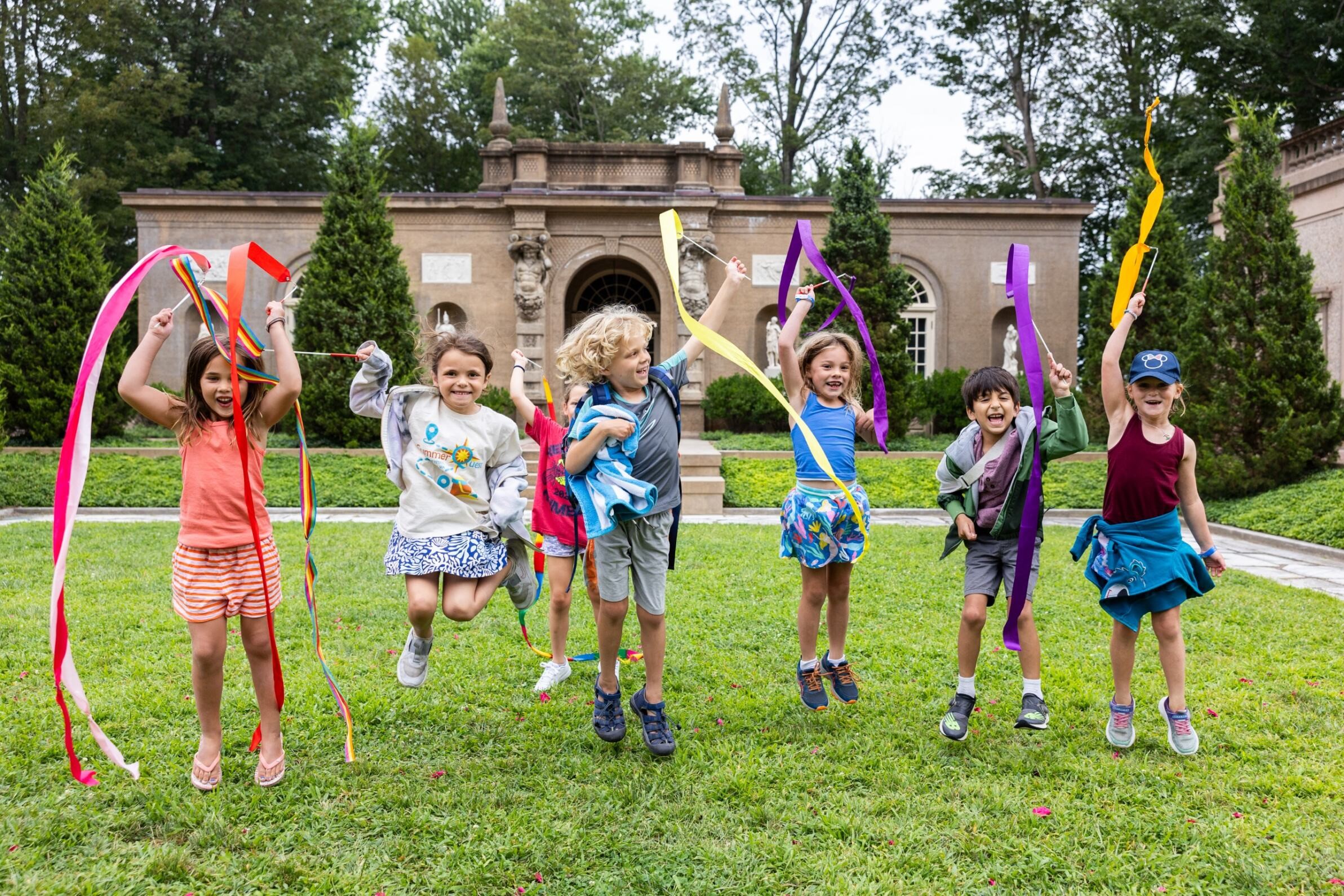 Campers jump with joy at the Crane Estate