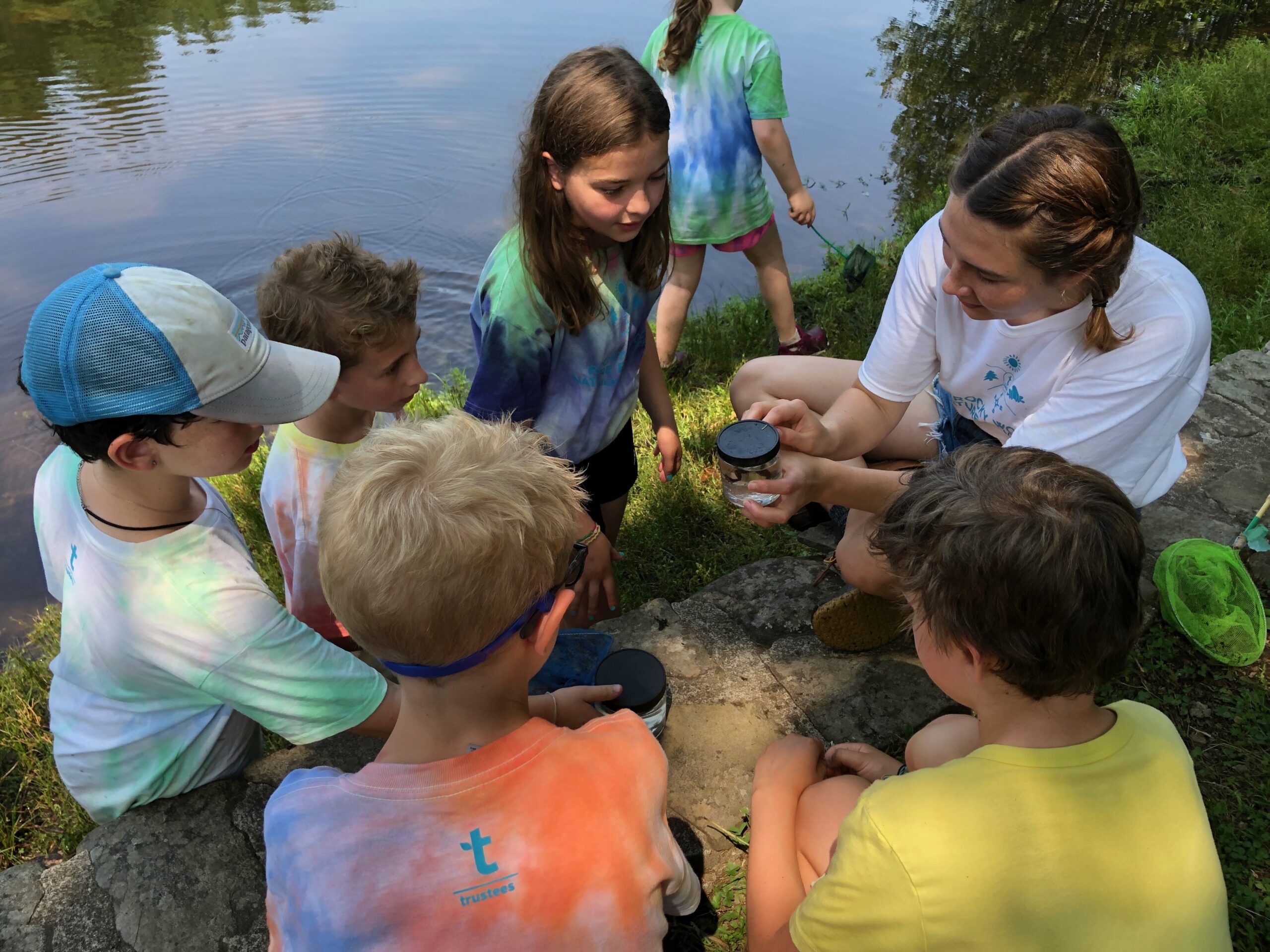 A group of campers ponding at Rocky Woods Nature Explorers Camp